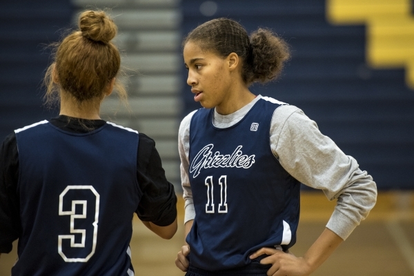 Kayla Harris, right, talks with Essence Booker during basketball practice at Spring Valley H ...