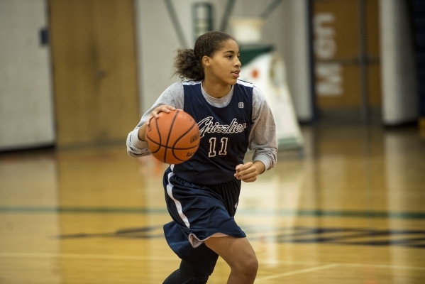 Kayla Harris runs with the ball during basketball practice at Spring Valley High School in L ...