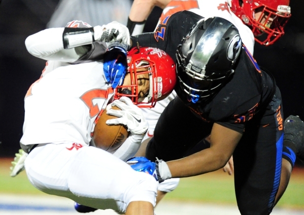 Bishop Gorman linebacker Hester Farrell (53) tackles Arbor View running back Curtis Jones in ...