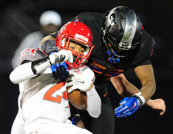 Bishop Gorman linebacker Hester Farrell (53) tackles Arbor View running back Curtis Jones in ...