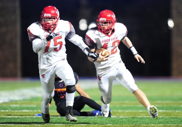 Arbor View fullback Andrew Wagner (42) rushes the ball as Arbor View offensive lineman defen ...