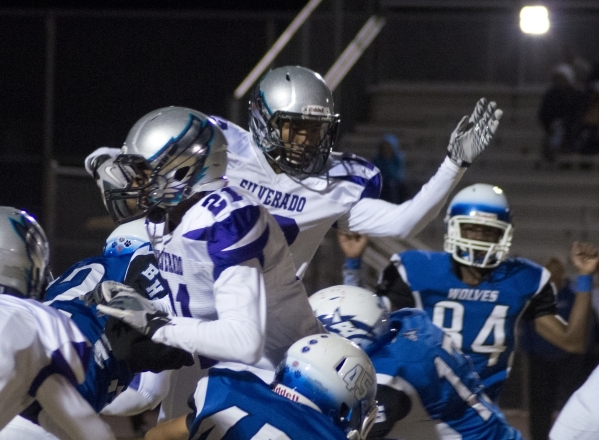 Silverado‘s Devion Clayton (12) jumps through a tangle of players during the Sunrise R ...