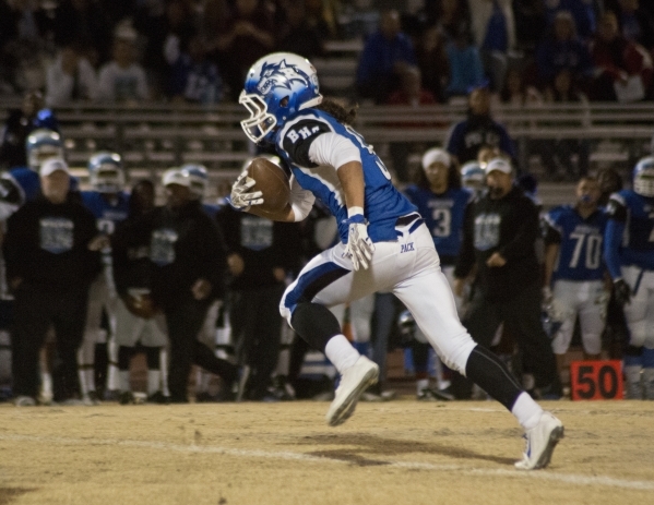 Basic‘s Brian Evans (9) runs the ball up the field during the Sunrise Region semifinal ...