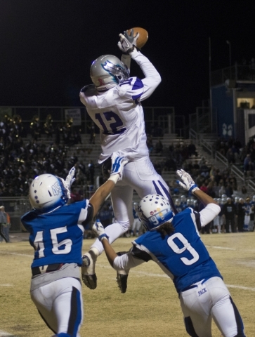 Silverado‘s Devion Clayton (12) catches a pass while covered by basic players Frank Ha ...