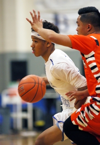 Desert Pines‘­ Capri Uzan, left, has possession of the ball and is guarded by Chaparr ...