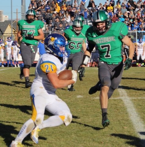 Moapa Valley running back Sterling Simmons gains yardage against Churchill County in the fir ...