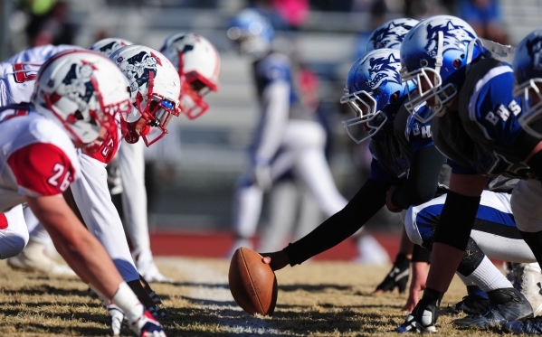 The Basic Wolves offensive line and the Liberty defensive line are seen in the second half o ...