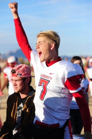 Liberty quarterback Kenyon Oblad celebrates after Liberty recovered a Basic fumble in the fo ...