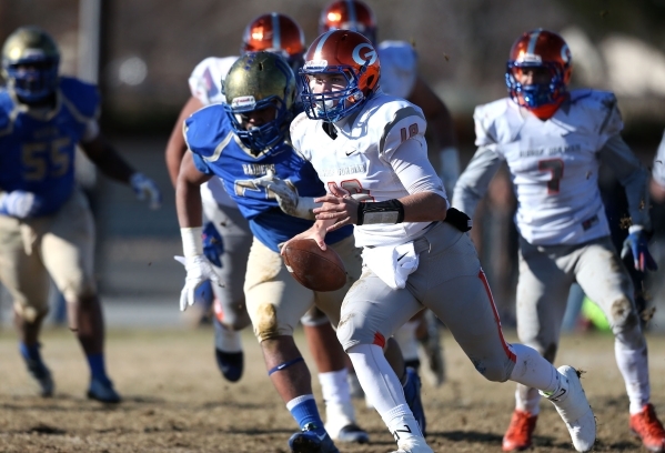 Bishop Gorman quarterback Tate Martell runs against Reed in an NIAA Division I playoff game ...