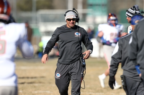Bishop Gorman Head Coach Kenny Sanchez works the sidelines of an NIAA Division I playoff gam ...