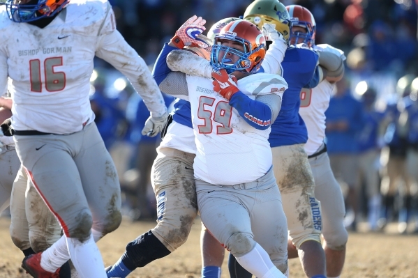 Bishop Gorman‘s Alfredo Bernall III (59) battles against Reed in an NIAA Division I pl ...