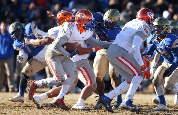 Bishop Gorman‘s Biaggio Ali Walsh (7) runs against Reed in an NIAA Division I playoff ...