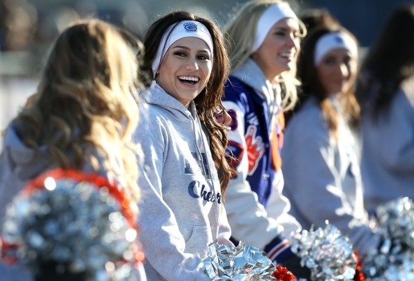 Bishop Gorman cheerleaders work the sidelines of an NIAA Division I playoff game at Reed Hig ...