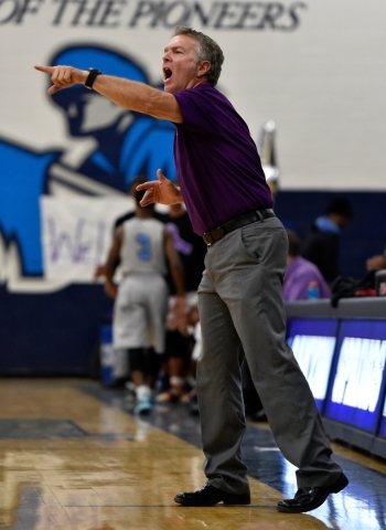 Cimarron-Memorial coach Daryl Branham calls to his team during a high school basketball game ...