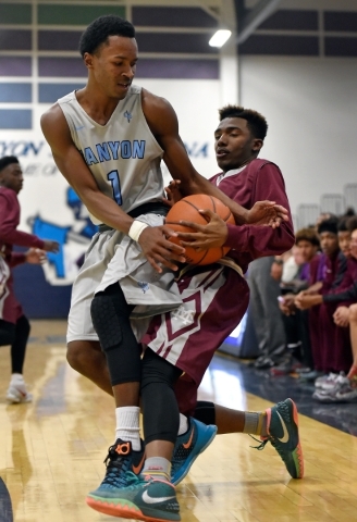 Canyon Springs‘ Derrick Legard, left, and Cimarron-Memorial‘ Demarco Morris figh ...