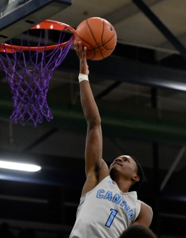 Canyon Springs‘ Derrick Legard shoots against Cimarron-Memorial‘ Demarco Morris ...