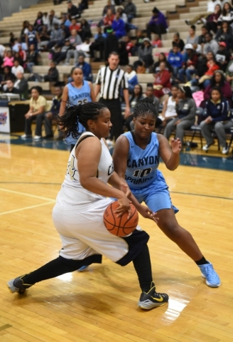 Cheyenne‘s Alexcia Weatherly (24) and Canyon Springs Destini Hunter (10) fight for a r ...