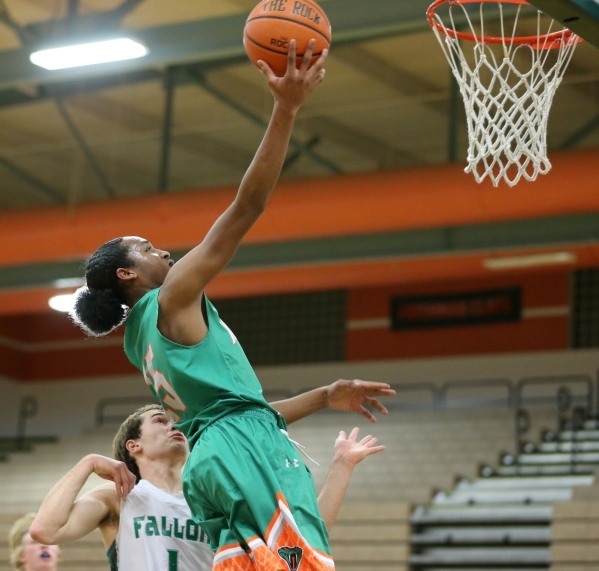 Mojave‘s Richard Edwards (15) goes up for a layup against Churchill County in their bo ...