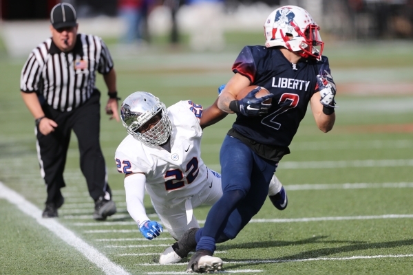 Liberty‘s Ethan Dedeaux (2) runs the ball against Bishop Gorman in the Division I stat ...