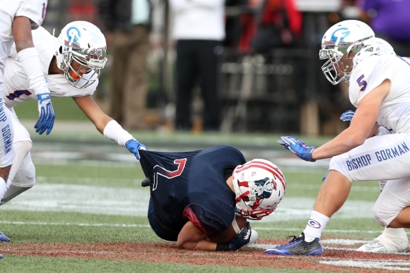 Liberty‘s Ethan Dedeaux (2) is tackled by Bishop Gorman in the Division I state champi ...