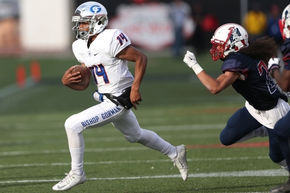 Bishop Gorman‘s Dorian Thompson-Robinson (14) runs the ball against Liberty in the Div ...
