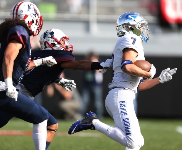 Bishop Gorman‘s Biaggio Ali Walsh (7) runs the ball for a touchdown against Liberty in ...