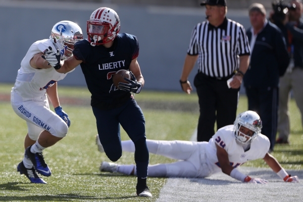 Liberty‘s Ethan Dedeaux (2) runs the ball against Bishop Gorman in their Division Stat ...