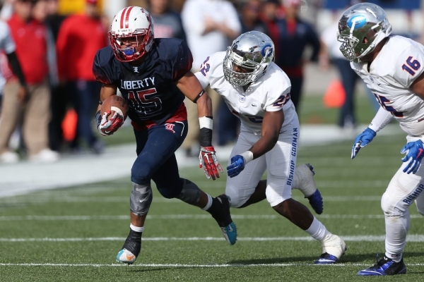 Liberty‘s Stephon Stowers (15) runs the ball against Bishop Gorman in the Division I s ...