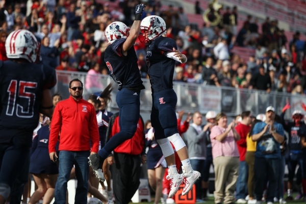 Liberty‘s Ethan Dedeaux (2) celebrates his touchdown catch with Kenyon Oblad (7) in th ...