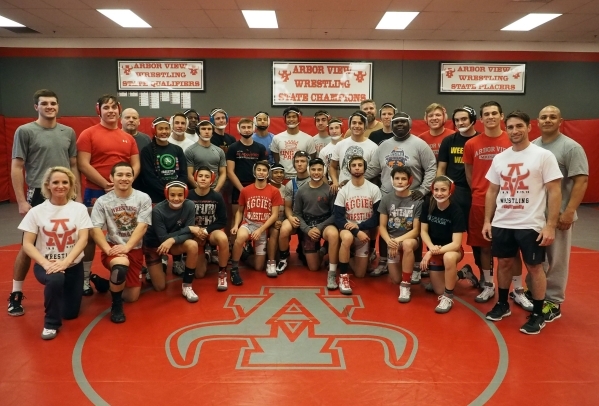 The varsity wrestling team poses for a group photo at Arbor View High School in Las Vegas, T ...