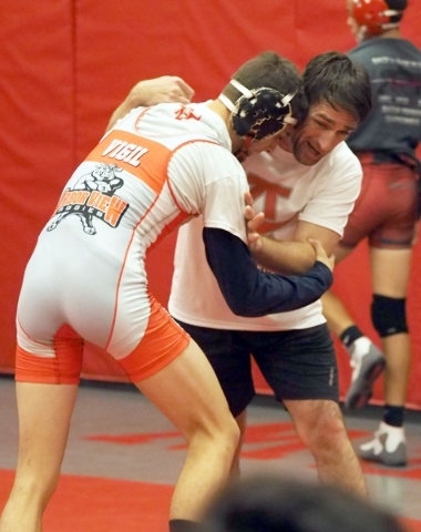Wrestler Lawrence Vigil works with Coach Rusty Marchello at Arbor View High School in Las Ve ...