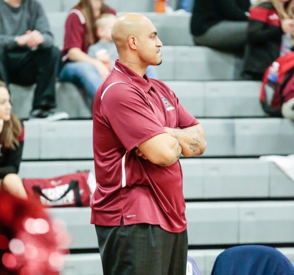 Desert Oasis assistant coach Marcus Fizer observes his players down court in a matchup with ...