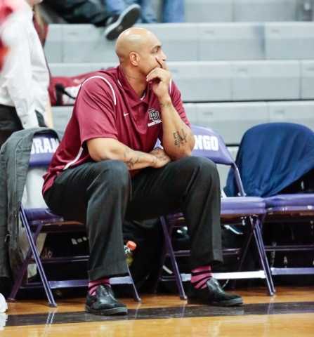 Desert Oasis assistant coach Marcus Fizer observes his players down court in a matchup with ...