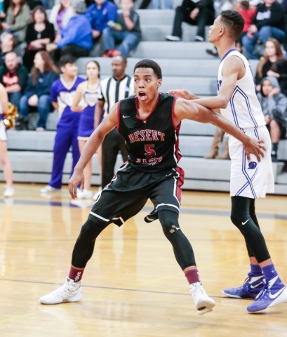 Desert Oasis senior forward Aamondae Coleman (5) reaches up for the ball along with Durango ...