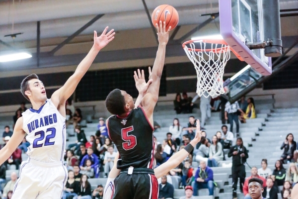 Desert Oasis senior forward Aamondae Coleman (5) jumps for a shot as Durango‘s Senior ...