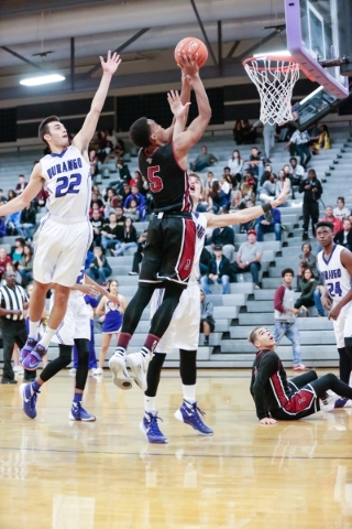Desert Oasis senior forward Aamondae Coleman (5) jumps for a shot as Durango‘s Senior ...