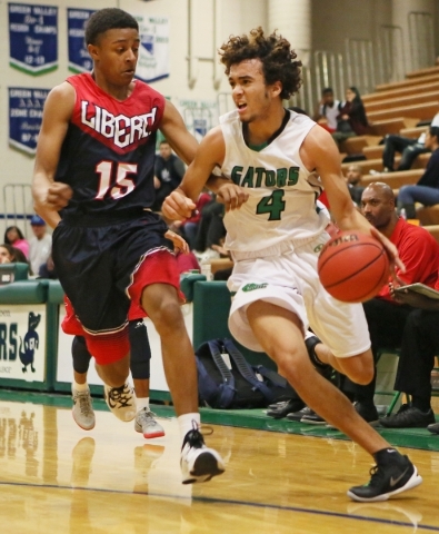 Green ValleyÃ­s Xavier Jarvis, right, is defended by LibertyÃ­s Cameron Burist during a ...