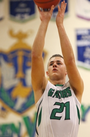 Green ValleyÃ­s Canyon Lewis shoots a free throw during a basketball game against Liberty ...