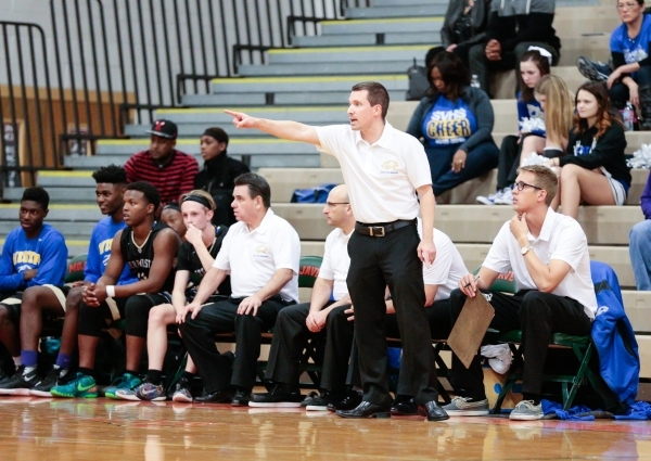 Sierra Vista High School head coach Keith Ulrich points across the court to one of his playe ...