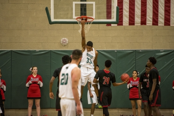 Lamont Traylor (33) of the Rancho Rams dunks the ball against the Las Vegas Wildcats during ...