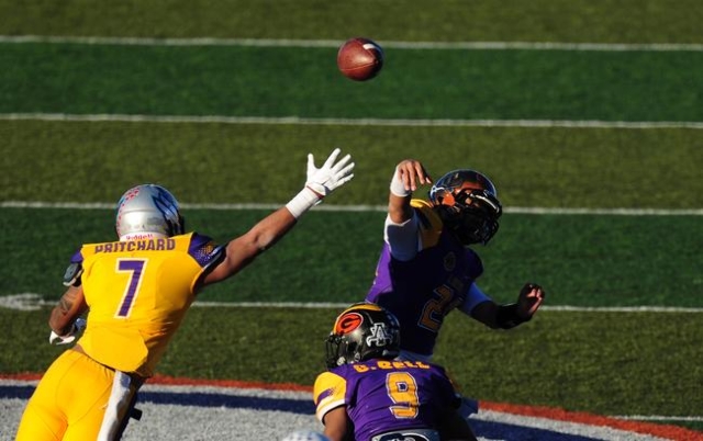 Sunset All-Stars quarterback Tanoa Alapati (21) throws an interception to Sunrise safety Zac ...
