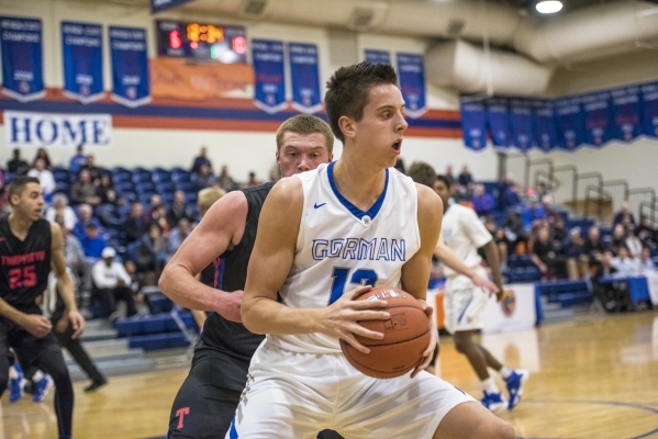 Bishop Gorman center Zach Collins (12) holds the ball while being defended by Timpview (Utah ...