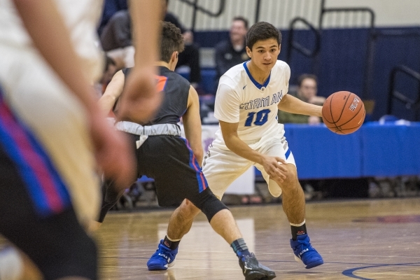 Bishop Gorman guard Luke Bradford (10) moves with the ball while being defended by Timpview ...