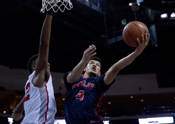 Findlay Prep‘s Skylar Mays (4) attempts to get the ball past Victory Prep‘s Jarr ...