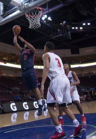 Findlay Prep‘s Carlos Johnson (3) takes the ball to the net during the fourth annual T ...