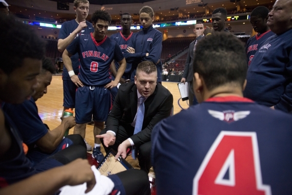 Findlay Prep‘s head coach Andy Johnson talks to his team during a timeout during the f ...