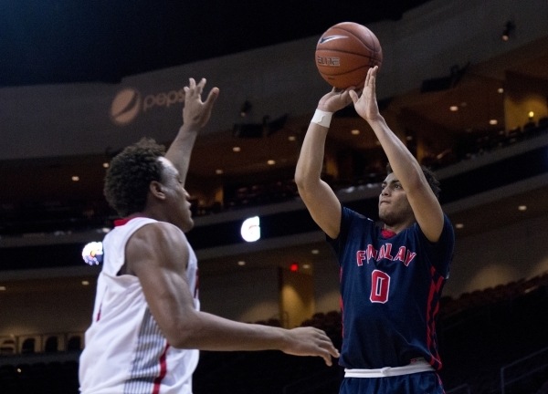 Findlay Prep‘s Markus Howard (0) attempts to put a three point shot over Victory Prep& ...