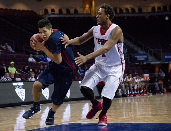 Findlay Prep‘s Skylar Mays (4) attempts to move the ball past Victory Prep‘s Joh ...