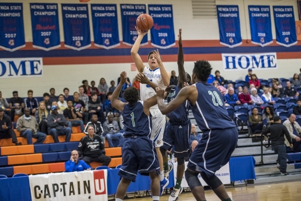Bishop Gorman forward Byron Frohnen (3) takes a shot against Overland, Colo., during the cha ...
