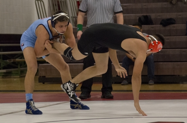 Centennial&lsquo;s Nico Antuna, left, wrestles Chaparral&lsquo;s Julio Bravo during a quad m ...